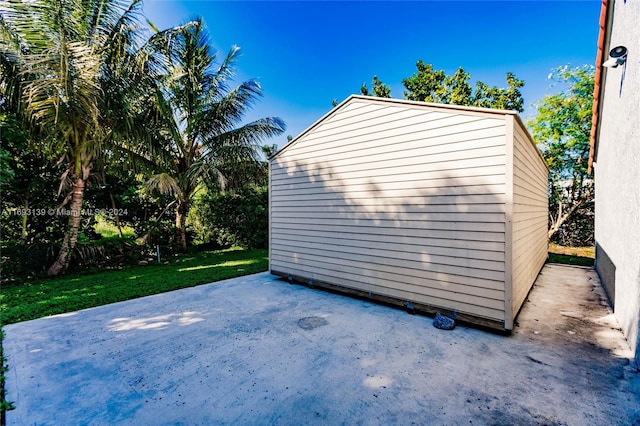 view of outdoor structure featuring a lawn