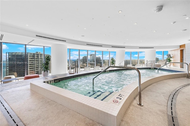 view of swimming pool featuring an indoor in ground hot tub