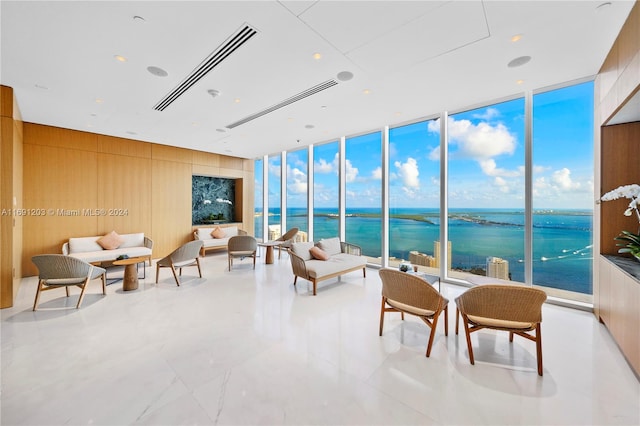 sunroom / solarium with a water view