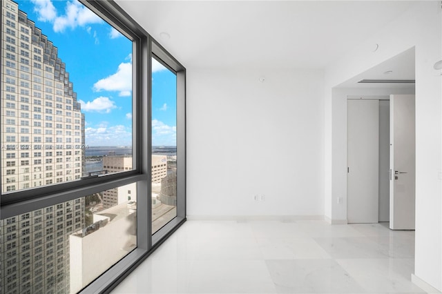 spare room with expansive windows