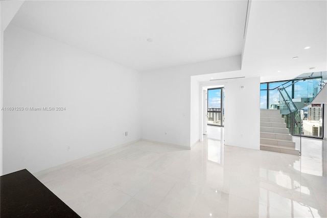 spare room with light tile patterned floors