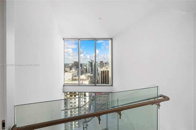 hallway featuring a wall of windows