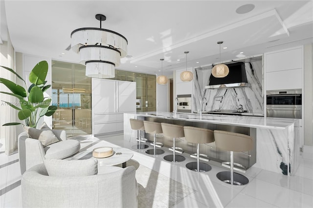 bar featuring light tile patterned flooring, extractor fan, light stone counters, white cabinets, and pendant lighting