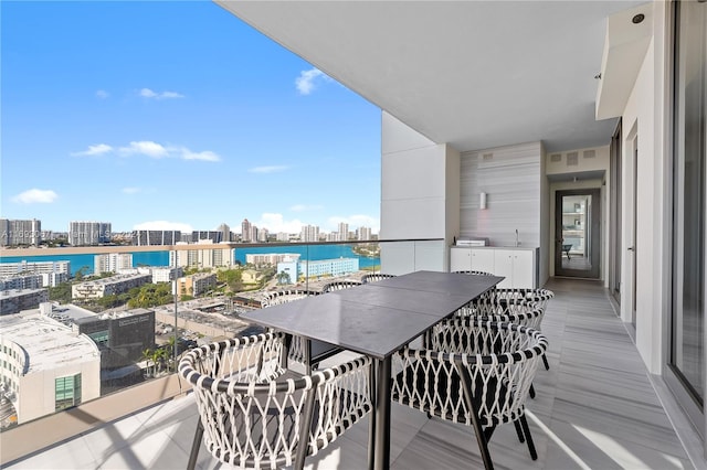 balcony featuring a water view