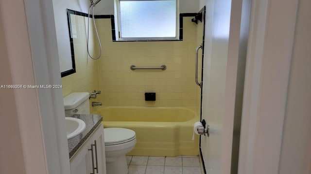 full bathroom with tile patterned floors, vanity, toilet, and tiled shower / bath combo