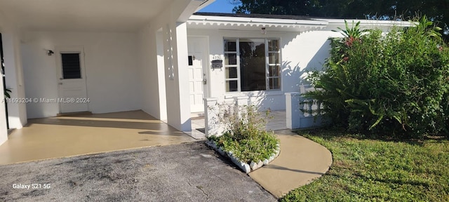 property entrance with a patio