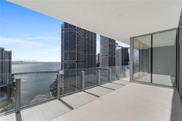 balcony featuring a water view