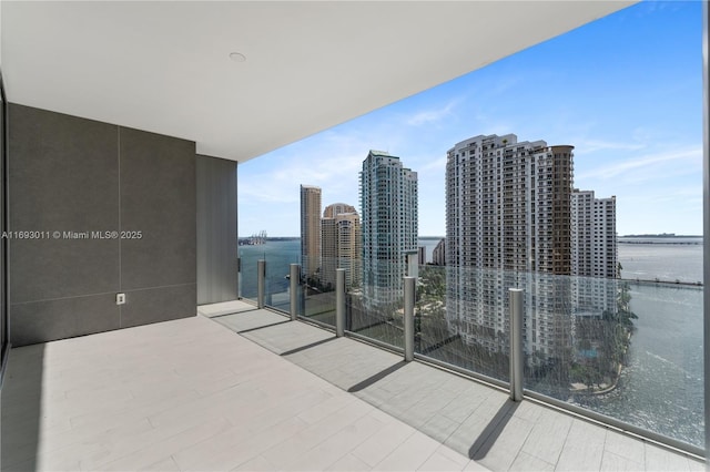 balcony featuring a water view