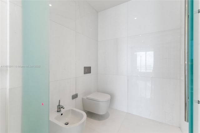 bathroom featuring a bidet, tile walls, and toilet