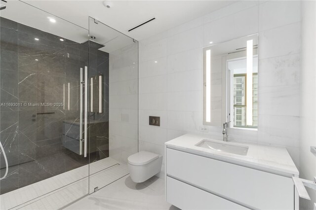 bathroom with a shower, vanity, toilet, and tile walls