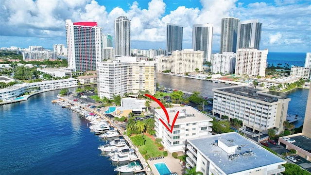 birds eye view of property featuring a water view