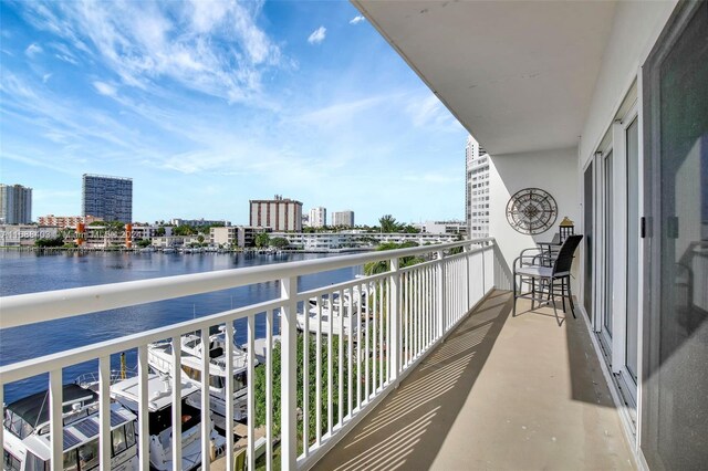 balcony featuring a water view