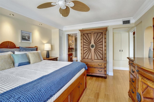 bedroom with ornamental molding, ensuite bath, ceiling fan, and light hardwood / wood-style flooring