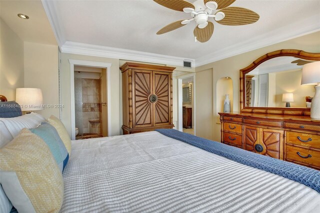 bedroom featuring ornamental molding, ceiling fan, and ensuite bathroom