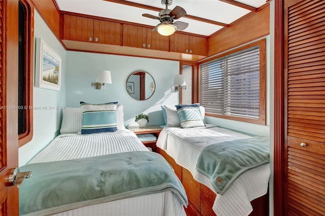 bedroom featuring ceiling fan and crown molding