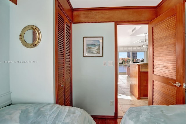 bedroom featuring a closet and light tile patterned floors