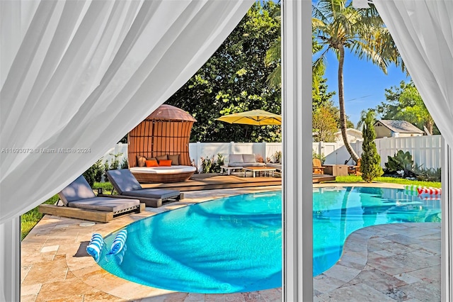 view of swimming pool featuring a patio area