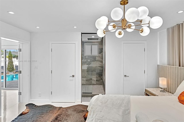 tiled bedroom with a notable chandelier