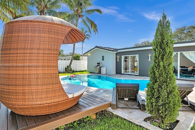 view of swimming pool with a wooden deck