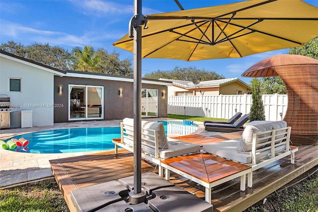 view of swimming pool with a wooden deck