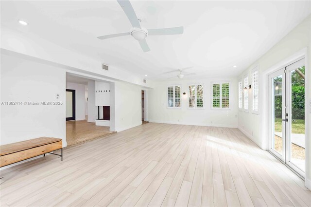 unfurnished room featuring light wood-type flooring and ceiling fan