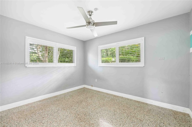 spare room with ceiling fan