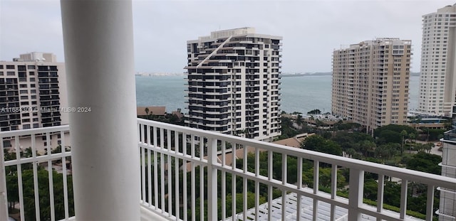 balcony featuring a water view