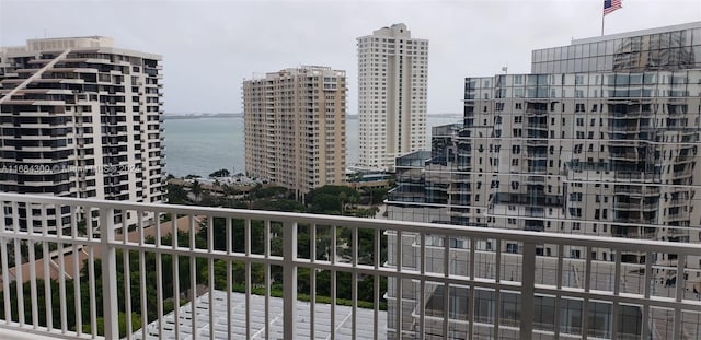 balcony featuring a water view