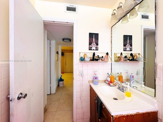 bathroom featuring tile walls, vanity, and tile patterned floors