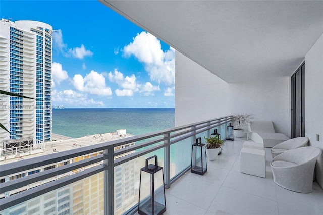 balcony featuring a water view