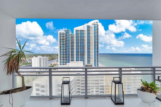 balcony featuring a view of city and a water view