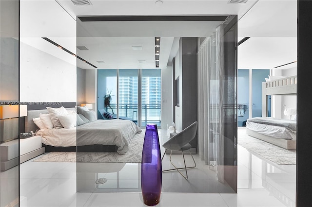 bedroom with a wall of windows, access to outside, visible vents, and tile patterned floors