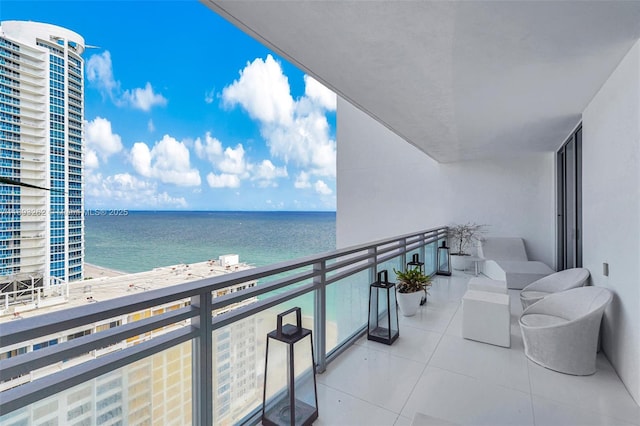 balcony featuring a water view