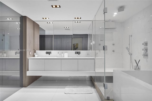 full bathroom featuring a garden tub, a sink, visible vents, double vanity, and a stall shower