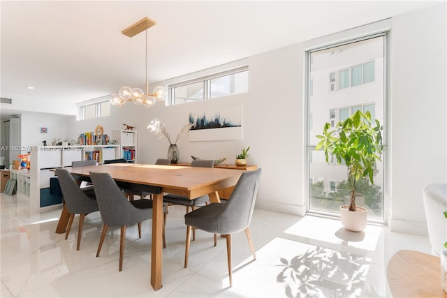 dining space featuring a chandelier