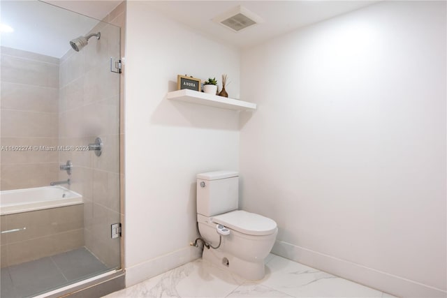 bathroom featuring walk in shower and toilet