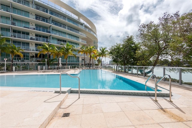 view of swimming pool with a patio