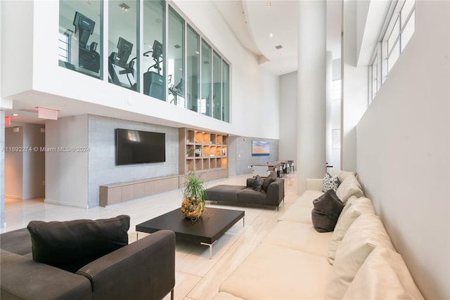 living room featuring a towering ceiling