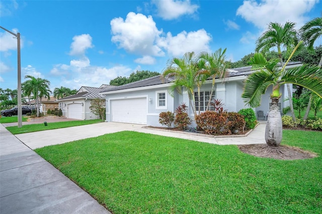 ranch-style house with a front lawn and a garage