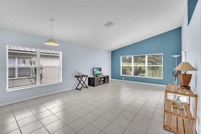 tiled living room featuring vaulted ceiling