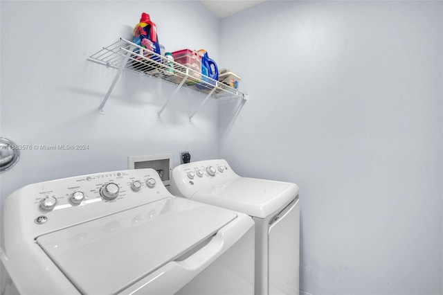 laundry room featuring washing machine and clothes dryer