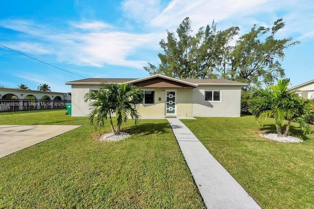 single story home with a front yard