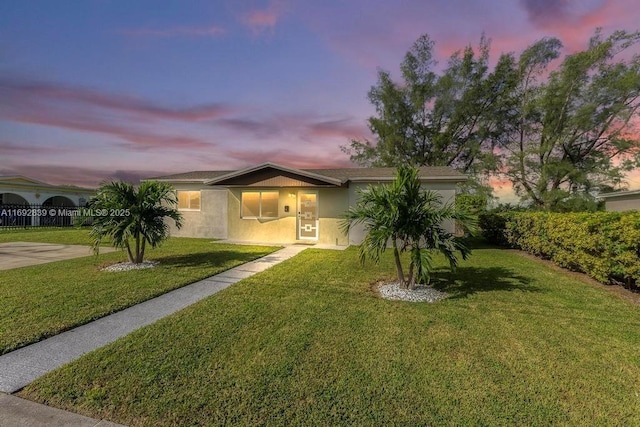 view of front of property with a lawn