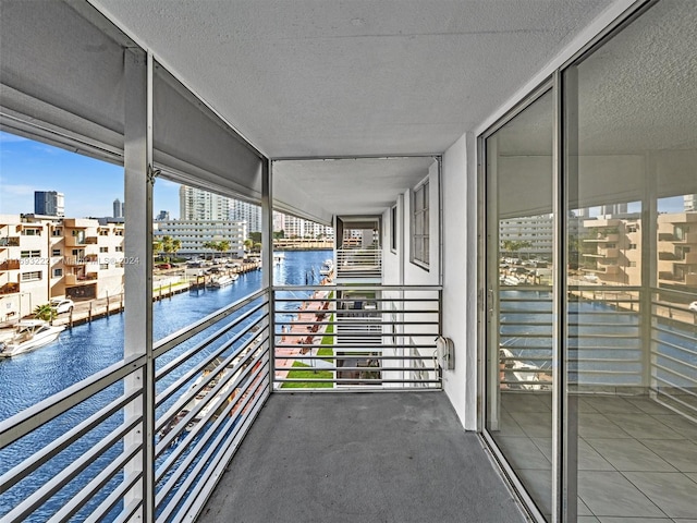 balcony featuring a water view