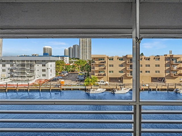 balcony featuring a water view