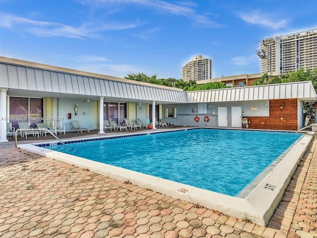 view of swimming pool featuring a patio area