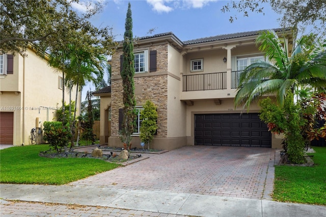 mediterranean / spanish-style house with a balcony, a garage, and a front lawn