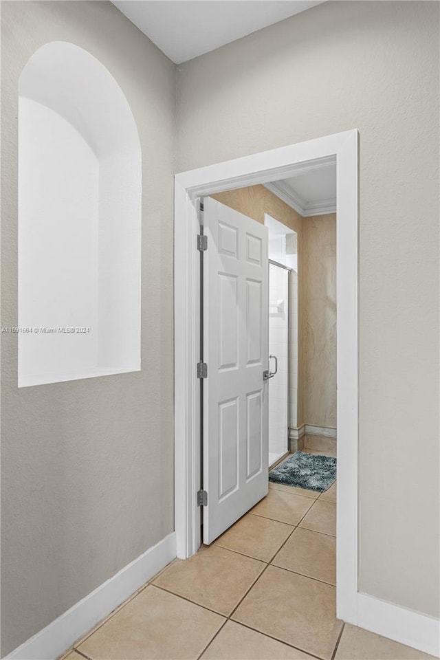 hallway with light tile patterned flooring