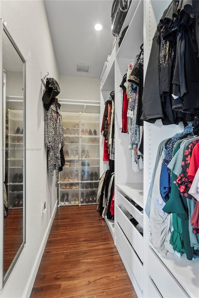 walk in closet featuring hardwood / wood-style floors