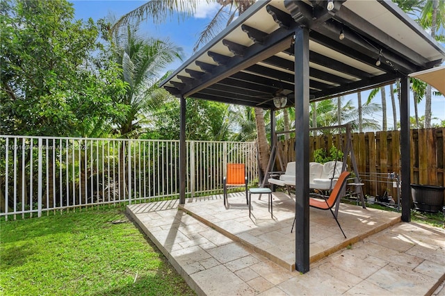 view of patio / terrace featuring ceiling fan